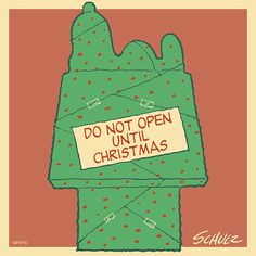 a green bag with a sign on it that says, do not open until christmas