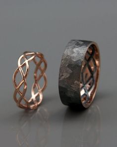 two rings with different designs on them, one in gold and the other in silver