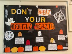 a bulletin board that says don't ghost your mental health with lots of pumpkins