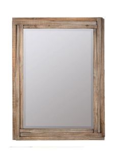 a wooden framed mirror on a white wall