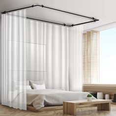 a bedroom with a bed and white curtains