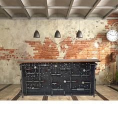 a room with brick walls and an old metal cabinet in the center, surrounded by hanging lights