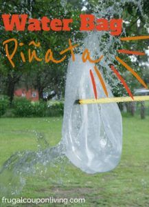 a plastic bag that is in the air with water coming out of it and an orange stick sticking out of it