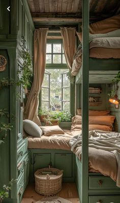 a bedroom with green painted walls and wooden flooring, built into the side of a building