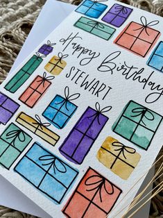 a birthday card with colorful presents on it