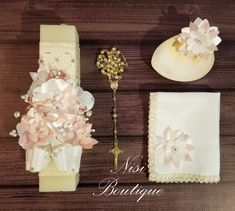 a table topped with lots of different items on top of a wooden floor covered in lace