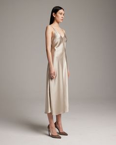 This elegant bias-cut slip dress features a spaghetti strap and flattering V Neck for a fresh, yet refined look. This perfect basic can be worn for life, dressed up, or dressed down, for the perfect effortless ensemble. 100% Silk Charmeuse Made in New York City Product Care: Dry Clean Only Nylon Dress, Silk Slip Dress, Silk Pants, Silk Charmeuse, Silk Slip, Silver Dress, Engineered Garments, Ethical Fashion, Dressed Down