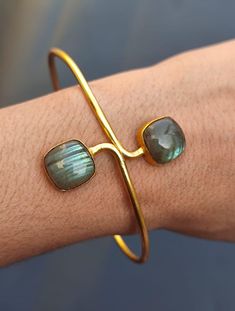 You will receive  1 Bangle Genuine Labradorite Cushion Cabochon Sleek Bangle Bracelet Gold Plated Bangle Handmade Vintage Style Fashion Jewelry Gift For Women Bangle Inner Diameter : 2.9" approx. Quantity : 1 Piece Thank you very much for visiting ! Any questions, please feel free to contact us. Discount for bulk provide. Elegant Cabochon Bangle Jewelry, Luxury Adjustable Cabochon Cuff Bracelet, Vintage Cabochon Bangle Bracelets, Vintage Cabochon Bangle Bracelet, Stone-embedded Bangle Cuff Bracelet For Gift, Gold Plated Bangles, Handmade Bangles, Gold Bangle Bracelet, Style Vintage