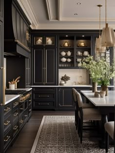 an elegant kitchen with black cabinets and gold accents