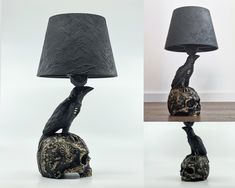 a lamp that is sitting on top of a skull and has a black shade over it