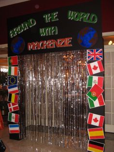 an entrance to the world with magnets and flags hanging from it's sides