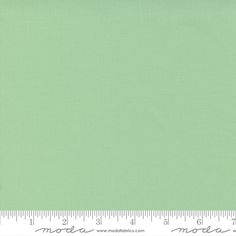 a ruler with a green background