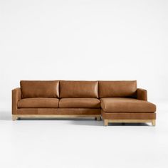 Long, low and made for lounging, our Pacific leather sectional complements contemporary living rooms with its easy, breezy style and the luxury of full-grain leather. Sustainably sourced wood with a light finish anchors the right-arm chaise and left-arm sofa with square legs and a full rail. Along with pillowy back cushions, the bull-nosed seats ensure a relaxing stay with medium-density, not-too-deep cushions. Rich and rustic leather upholstery takes the two-piece sectional sofa to the next lev Light Leather Couch, Tan Leather Sectional, Contemporary Living Rooms, Leather Chaise Sectional, L Sofas, Chaise Sectional Sofa, Breezy Style, Sofa Review, Leather Couch