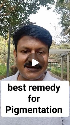 a man holding a sign that says best remedy for pigmentation