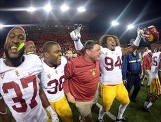 the football players are celebrating on the field