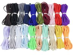 many colors of cords are lined up on a white background and one is multicolored