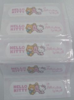 three hello kitty stickers are in the package