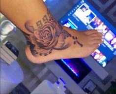 a person with a rose tattoo on their foot