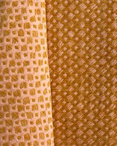 three different colored fabrics are shown in close up view, one yellow and the other white