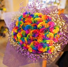 a bouquet of colorful flowers on top of a table