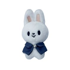 a white stuffed animal with a blue bow around it's neck