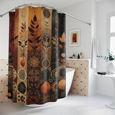 a bathroom with a shower curtain that has different designs on it and is next to a bathtub