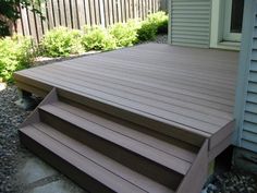 a wooden deck with steps leading up to it