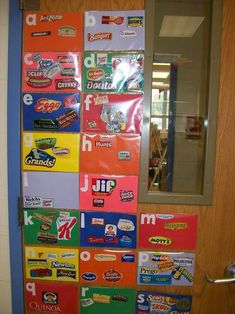 the door is decorated with many different types of candy wrappers and other stickers