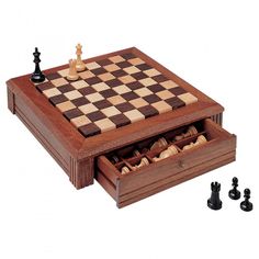 a wooden chess set with pieces in it