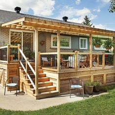 a small wooden house with stairs leading up to the front porch and covered patio area