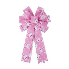 a pink bow with white rabbits on it