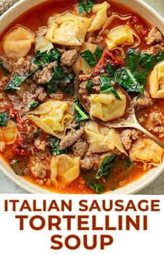 a bowl of italian sausage tortellini soup with spinach