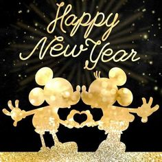 a happy new year greeting card with two mice in gold foil and sparkles on a black background