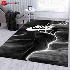 a black and white rug with the nike logo on it in front of a chair