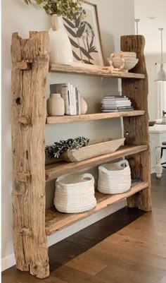 a wooden shelf with baskets and books on it