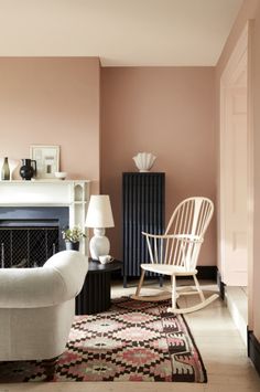 a living room filled with furniture and a fire place