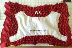 a piece of fabric with the words ws on it and an image of a pillow