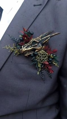 a man wearing a suit and tie with a skull on it