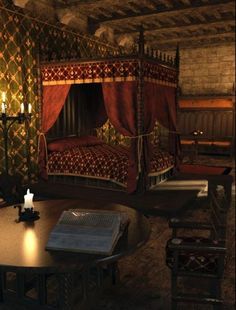 a bed sitting in the middle of a room next to a table with candles on it