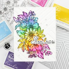 a card with some flowers on it next to other cards and stamping materials