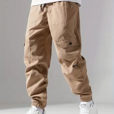 Casual Loose Fit Multi-pocket Drawstring Cargo Pants, Men's Joggers For Spring And Fall Joggers With Pockets, Tapered Leg Outdoor Pants With Pockets, Outdoor Tapered Leg Pants With Pockets, Urban Style Sweatpants With Pockets, Cargo Pocket Sweatpants For Outdoor Activities, Baggy Sweatpants With Pockets For Outdoor Activities, Utility Joggers With Pockets For Outdoor Activities, Urban Sweatpants For Outdoor Activities, Joggers With Side Pockets For Outdoor Activities