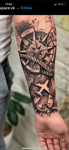 a man with a compass tattoo on his arm