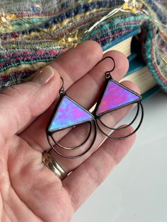 Earring design that is clean-lined and minimalist, flattering for a casual or dressed up look. The simple style is eye-catching with the iridescent glass and is colorfully reflective in the light.  Handmade with glass and lead-free solder. Hung from niobium hypo-allergenic ear-wire.  Size: 1.5in x 1.25in Color: opaque red  Iridescent colors reflect: amber, blue and purple PROCESS: The process of stained glass is very labor intensive, and each step is done entirely by hand. First, each piece of glass is cut into shape, and the edges are then ground smooth. Cooper tape is wrapped and secured around the edges of each piece. The lead-free silver solder is melted and adheres to the copper foil. Finally, wax is used to clean and polish the piece. This lengthy process lends to stained glass that Stained Glass Earrings Diy, Modern Multicolor Earrings For Everyday, Stained Glass Necklace, Stained Glass Pendant, Stained Glass Earrings, Goth Earrings, Stained Glass Jewelry, Steampunk Accessories, Stained Glass Diy