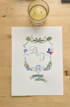 a paper with the word d & g on it next to a candle