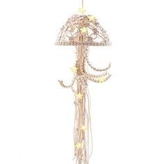 a white lamp with stars hanging from it's side