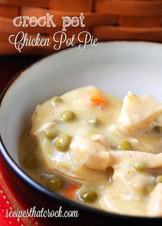 a white bowl filled with chicken pot pie soup on top of a red table cloth