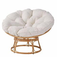 a chair with a white cushion on it's back and seat pad in the middle