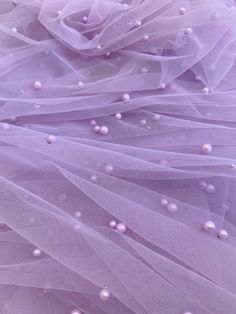 purple tulle with white pearls on it