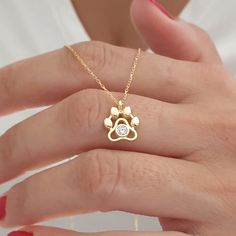 10k 14k 18k Solid Gold Paw Necklace, Dog Paw Charm Necklace, Pet Memorial Necklace, Paw Print Necklace For Dog Lover, Dog and Cat Paw Charm  This necklace is handmade and produced with 10k 14k 18k solid gold according to your preference. Material : 10kt 14kt 18kt Solid Gold Gold Color : Yellow Gold, White Gold, Rose Gold Gemstone : Cubic Zirconia Pendant size: Heigth : 0.39 inches ( 10 mm ) Width : 0.39 inches ( 10 mm ) We have 3 types solid gold chain options: Type1 Chain (0.85mm thick) Type2 C Paw Jewelry, Paw Necklace, Pet Memorial Necklace, Paw Print Necklace, Solid Gold Chains, Memorial Necklace, Cat Paw, Product Ideas, Dog Paw