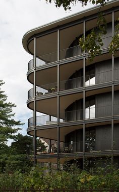 an apartment building with balconies on the second floor